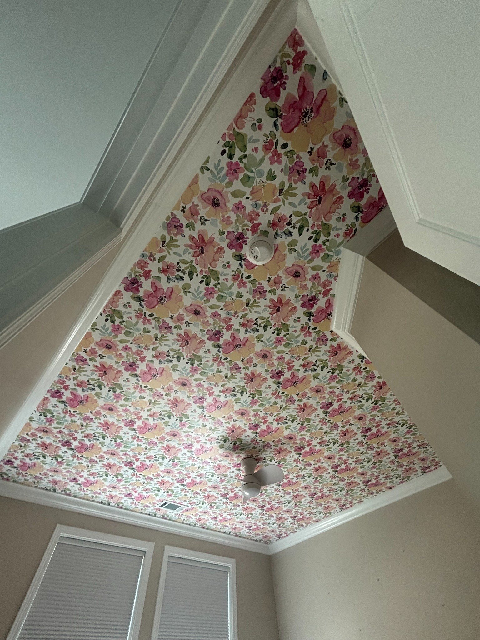Floral wallpaper installed on a tray ceiling